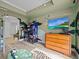 Game room with arcade game and large screen TV at 7502 Seven Eagles Way, Reunion, FL 34747
