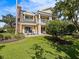 Two-story condo with patio and lush landscaping at 7502 Seven Eagles Way, Reunion, FL 34747