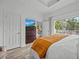 Bright bedroom with large windows and a comfortable bed at 7502 Seven Eagles Way, Reunion, FL 34747