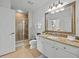 Bathroom with granite vanity and walk-in shower at 7502 Seven Eagles Way, Reunion, FL 34747