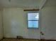 Empty interior room with a window and markings on the wall at 1472 Marvin C Zanders Ave, Apopka, FL 32703