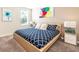 King-size bed in a well-lit bedroom at 1548 Moon Valley Dr, Davenport, FL 33896