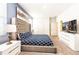 Spacious Primary bedroom with large bed and TV at 1548 Moon Valley Dr, Davenport, FL 33896