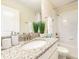 Clean bathroom with granite countertop and bathtub at 1548 Moon Valley Dr, Davenport, FL 33896
