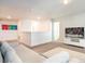 Spacious game room with a sectional sofa and TV at 1548 Moon Valley Dr, Davenport, FL 33896