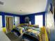 Minion themed bedroom with twin beds and TV at 1548 Moon Valley Dr, Davenport, FL 33896