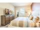 Spacious bedroom with king-size bed and large dresser at 1548 Moon Valley Dr, Davenport, FL 33896
