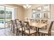 Dining room with large table and access to backyard at 1548 Moon Valley Dr, Davenport, FL 33896