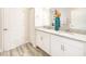 Bathroom with double vanity and granite countertop at 1548 Moon Valley Dr, Davenport, FL 33896