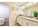 Double vanity bathroom with granite countertop at 1548 Moon Valley Dr, Davenport, FL 33896