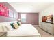 King-size bed in bedroom with TV and dresser at 1548 Moon Valley Dr, Davenport, FL 33896