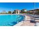 Resort-style pool with plenty of lounge chairs at 1548 Moon Valley Dr, Davenport, FL 33896