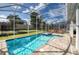 Resort-style pool and spa with screened enclosure at 1548 Moon Valley Dr, Davenport, FL 33896