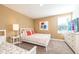 Bedroom with a queen bed and floral decor at 1548 Moon Valley Dr, Davenport, FL 33896