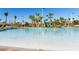 Lazy river pool with a waterslide and lounge chairs at 1548 Moon Valley Dr, Davenport, FL 33896