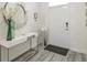 Bright and airy entryway with modern console table and mirror at 1548 Moon Valley Dr, Davenport, FL 33896