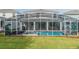 Large backyard with a screened-in pool and patio at 1548 Moon Valley Dr, Davenport, FL 33896