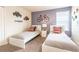 Bedroom with two twin beds, a dresser, and fun decor at 1548 Moon Valley Dr, Davenport, FL 33896