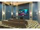 Relax and enjoy a movie in this private theater room at 1548 Moon Valley Dr, Davenport, FL 33896