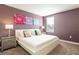 King-size bed in a bedroom with purple walls at 1548 Moon Valley Dr, Davenport, FL 33896