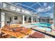 Inviting pool area with spa and covered patio, perfect for relaxation at 1548 Moon Valley Dr, Davenport, FL 33896