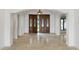 Bright and spacious entryway with double doors and travertine floors at 325 Magnolia St, Windermere, FL 34786