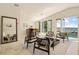 Gathering room with lake view and access to pool area at 325 Magnolia St, Windermere, FL 34786