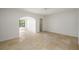Bright bedroom with tile flooring and access to sitting area at 325 Magnolia St, Windermere, FL 34786