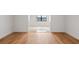 Bright room with hardwood floors and a view to another area with tile floors at 325 Magnolia St, Windermere, FL 34786