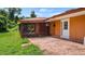Small back patio with access to sunroom and exterior door at 10611 Jim Edwards Rd, Haines City, FL 33844