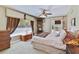 Spacious bedroom with large window, carpet, and dresser at 10611 Jim Edwards Rd, Haines City, FL 33844