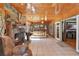 Main bedroom with a stone fireplace and access to a screened porch at 10611 Jim Edwards Rd, Haines City, FL 33844