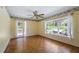 Bright bedroom with hardwood floors and access to patio at 10611 Jim Edwards Rd, Haines City, FL 33844