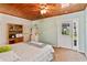 Cozy bedroom with a queen-size bed and lake view at 10611 Jim Edwards Rd, Haines City, FL 33844