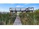 Rustic wooden dock extending into the lake at 10611 Jim Edwards Rd, Haines City, FL 33844