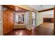 Home entry with stone accent wall and hardwood floors at 10611 Jim Edwards Rd, Haines City, FL 33844
