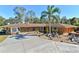 Ranch style home with stone exterior and landscaping at 10611 Jim Edwards Rd, Haines City, FL 33844