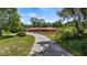 Ranch home with long driveway and mature trees at 10611 Jim Edwards Rd, Haines City, FL 33844