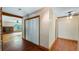 Hallway with wood flooring, closet, and views into other rooms at 10611 Jim Edwards Rd, Haines City, FL 33844