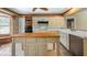 Kitchen with island, stainless steel appliances, and view of the lake at 10611 Jim Edwards Rd, Haines City, FL 33844
