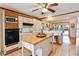 Kitchen with island, stainless steel appliances, and view of the lake at 10611 Jim Edwards Rd, Haines City, FL 33844