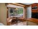Kitchen with wood cabinets and a built in breakfast nook at 10611 Jim Edwards Rd, Haines City, FL 33844