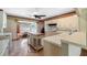 Kitchen features an island, white cabinets, and a breakfast nook at 10611 Jim Edwards Rd, Haines City, FL 33844