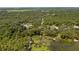 Aerial view showcasing waterfront property and neighborhood at 10611 Jim Edwards Rd, Haines City, FL 33844