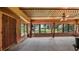 Sunroom with large windows offering scenic views and wood flooring at 10611 Jim Edwards Rd, Haines City, FL 33844