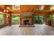 Spacious living room with a stone fireplace and wood-paneled ceiling at 10611 Jim Edwards Rd, Haines City, FL 33844