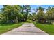 Gated entrance to a private property with lush landscaping at 10611 Jim Edwards Rd, Haines City, FL 33844