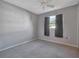 Bright bedroom with grey walls and carpet at 7685 Ceres Dr, Orlando, FL 32822