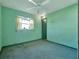 Light green bedroom with carpet flooring and ceiling fan at 7685 Ceres Dr, Orlando, FL 32822
