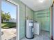 Laundry room with washer, dryer and exterior access at 7685 Ceres Dr, Orlando, FL 32822